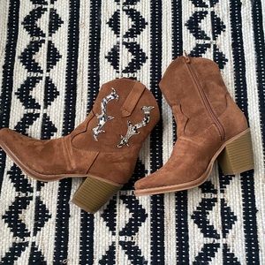 Brown cowgirl boots with snakeskin detail